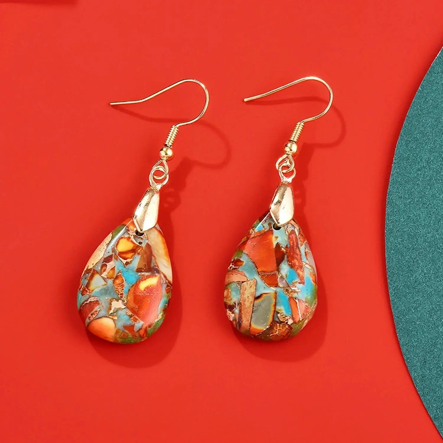 Elegant luxury women's earrings made of natural stones in the shape of a tear with an eye-catching design TETAEA