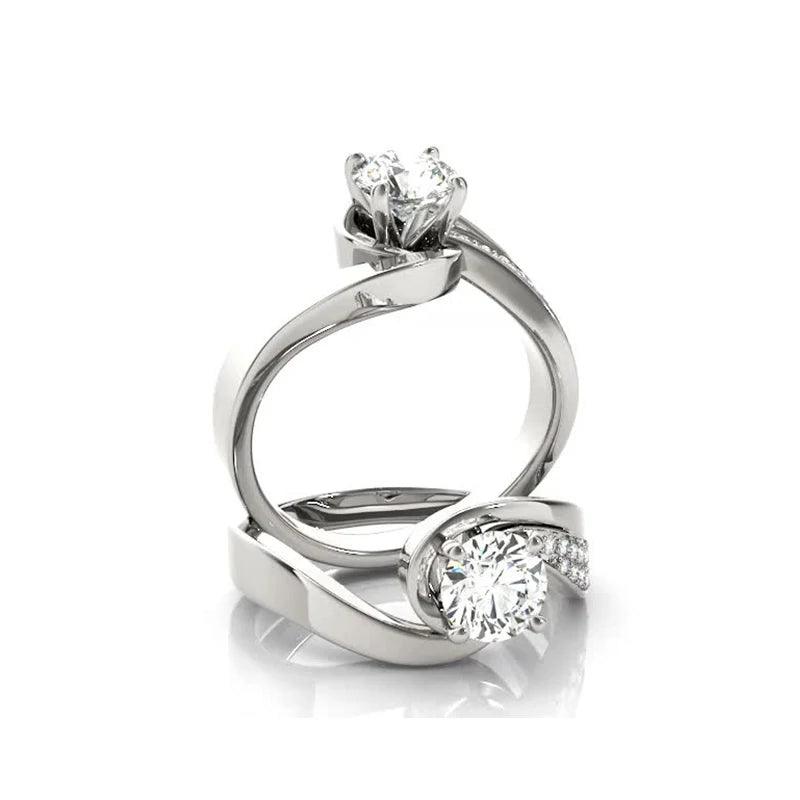 Simple elegant 4 claw ring in 925 sterling silver with 1 carat round cut diamonds and moissanite